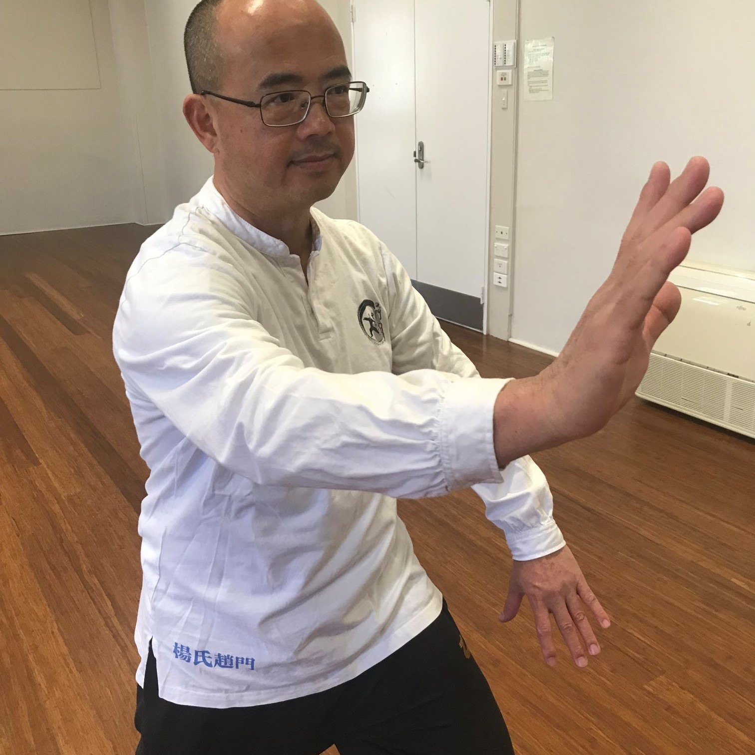 A man practicing Tai Chi